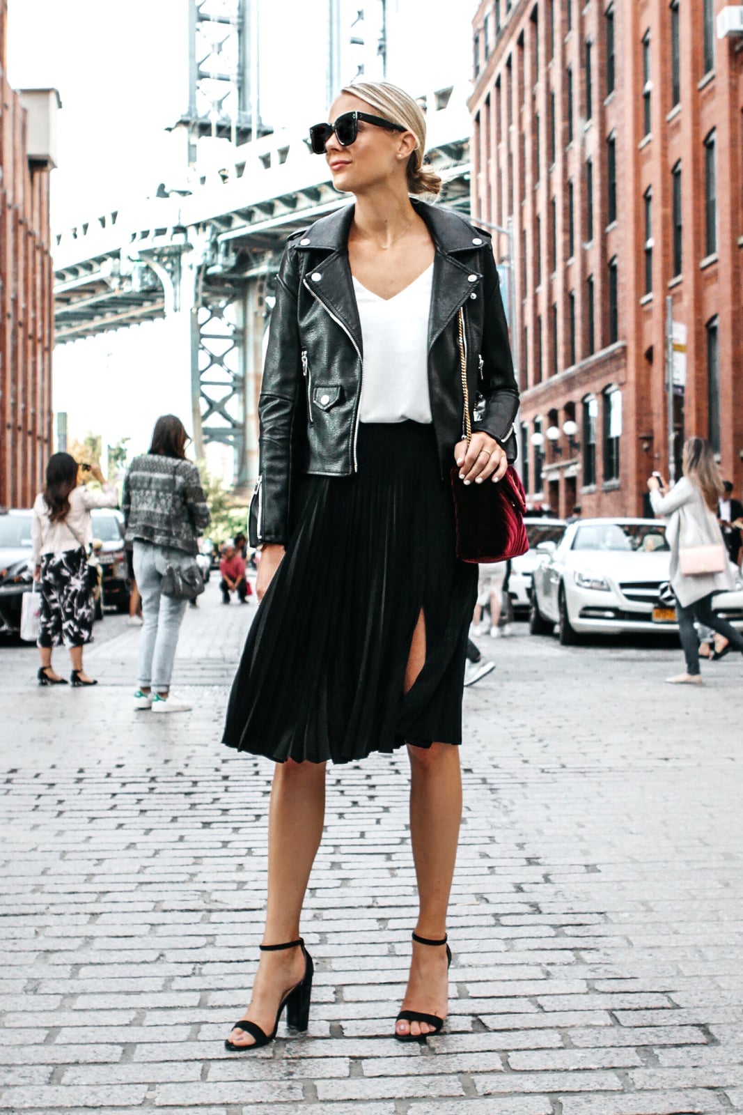 Black pleated midi skirt with thigh-high slit and moto jacket Black pleated midi skirt with thigh-high slit and moto jacket — Pleated Skirt Outfits