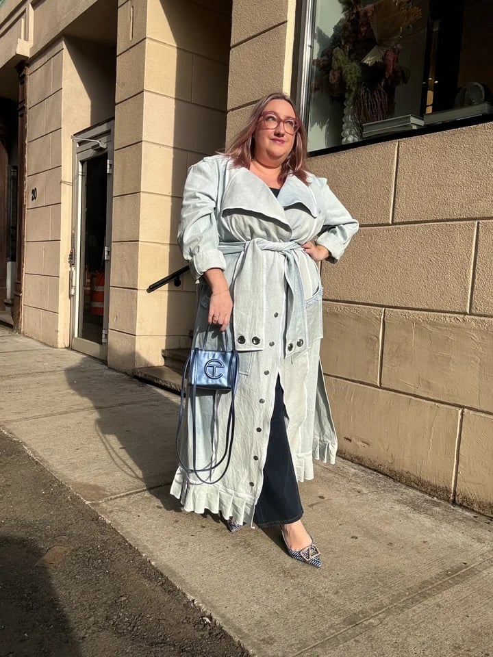 Pale blue trench coat over black top and wide-leg jeans Pale blue trench coat over black top and wide-leg jeans — Plus Size Outfits