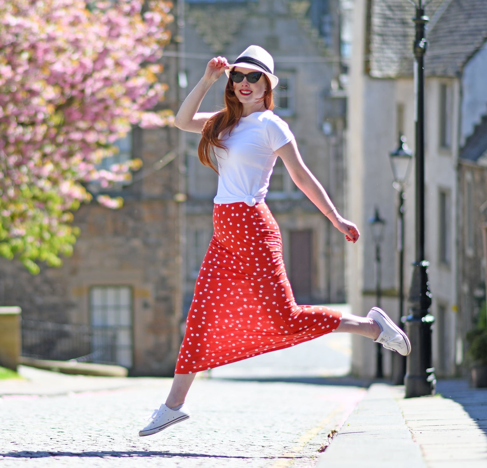 Red Polka Dot Maxi Skirt With White Tee and Sneakers, Close-Up Take Red Polka Dot Maxi Skirt With White Tee and Sneakers, Close-Up Take — Polka Dot Skirt Outfit
