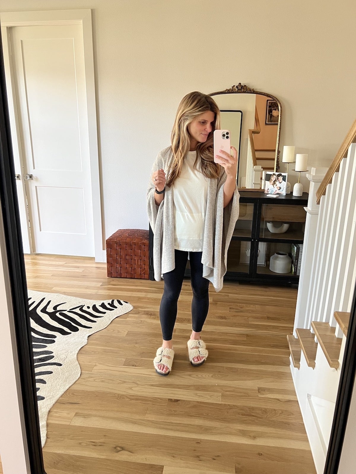 Beige knit poncho over white t-shirt and black leggings Beige knit poncho over white t-shirt and black leggings — Postpartum Outfits