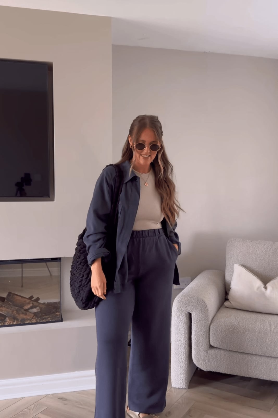 Navy oversized shirt jacket with beige top and navy trousers Navy oversized shirt jacket with beige top and navy trousers — Postpartum Outfits