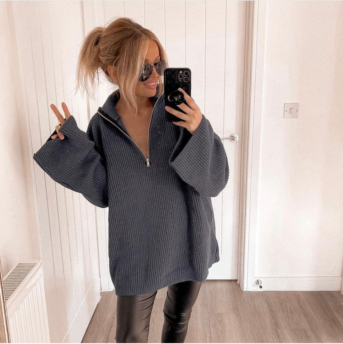 Dark gray quarter-zip knit sweater with black leggings Dark gray quarter-zip knit sweater with black leggings — Postpartum Outfits