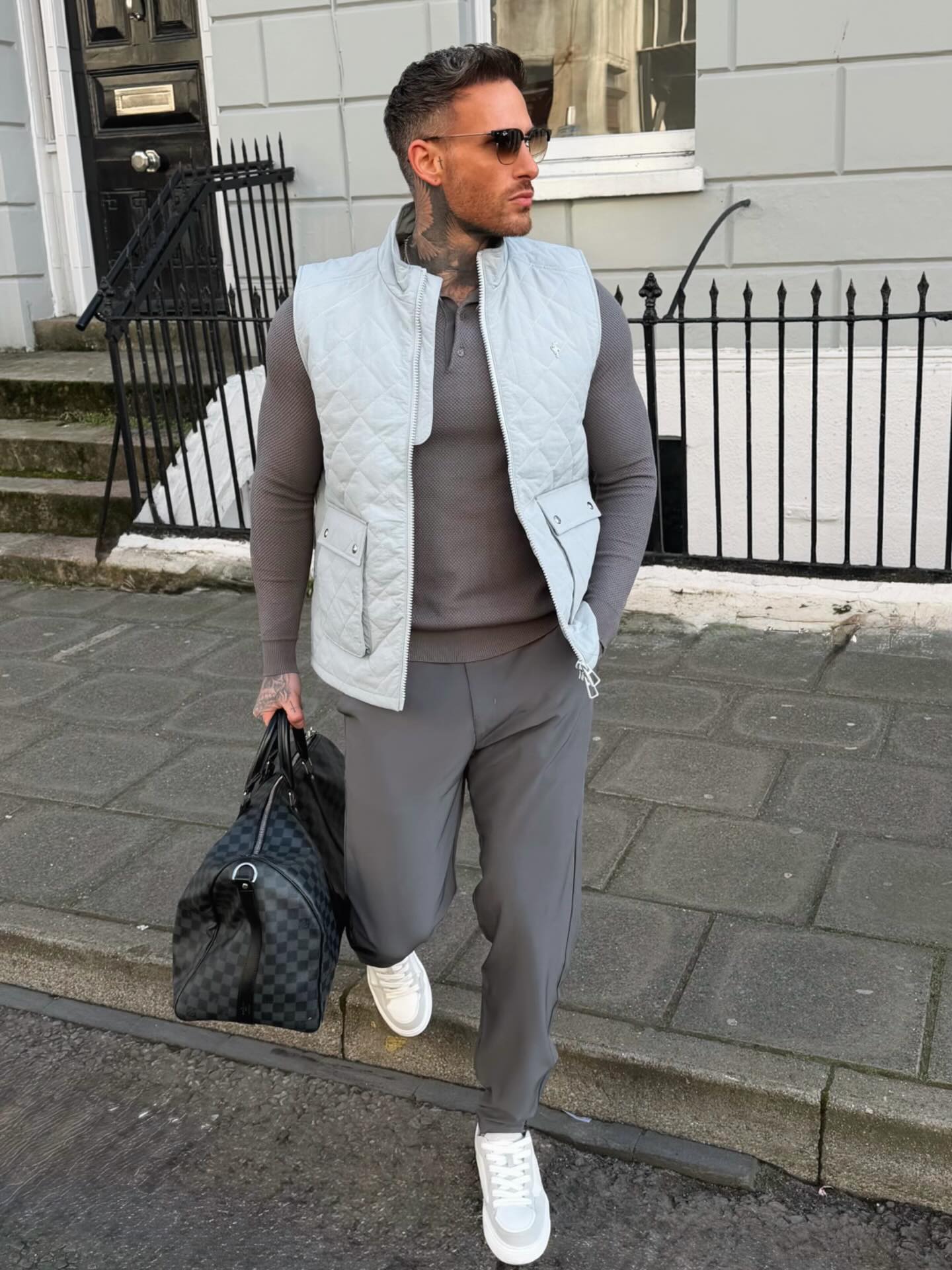 Quilted Vest Over Grey Polo and Trousers