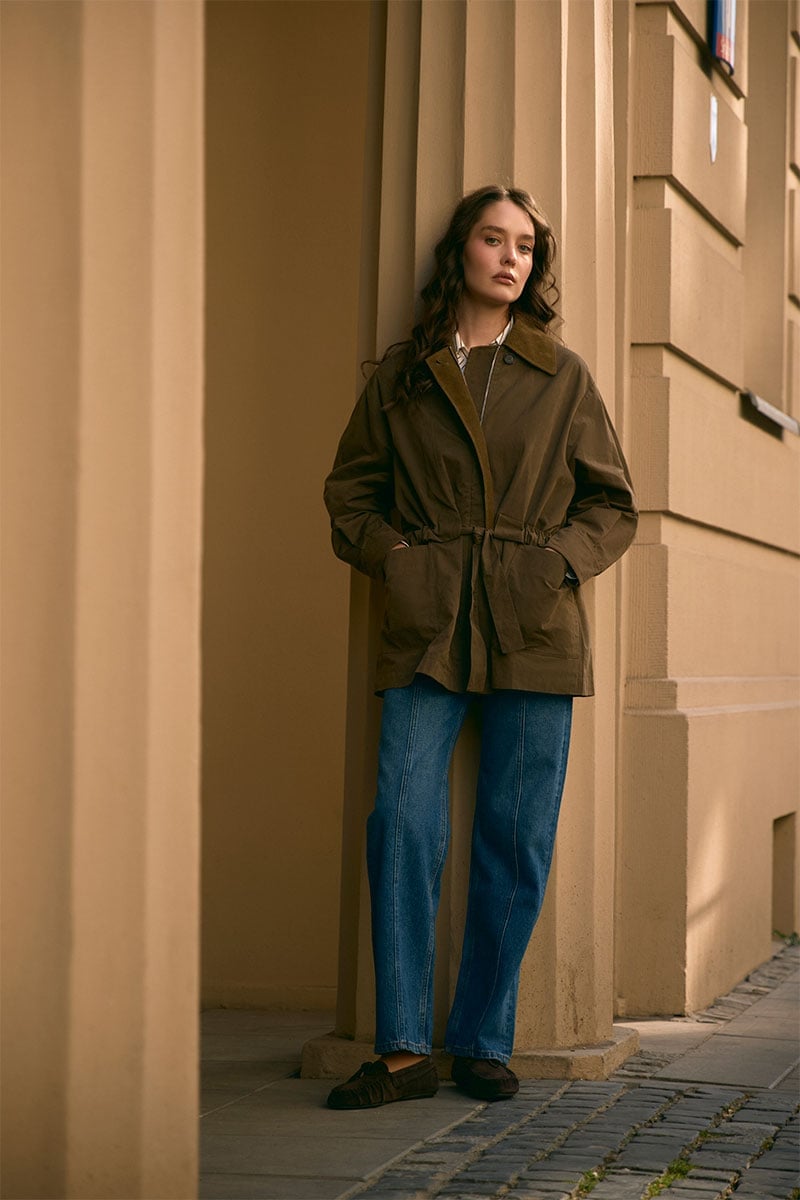Olive green utility jacket over white shirt and blue jeans Olive green utility jacket over white shirt and blue jeans — Rainy Day Outfits