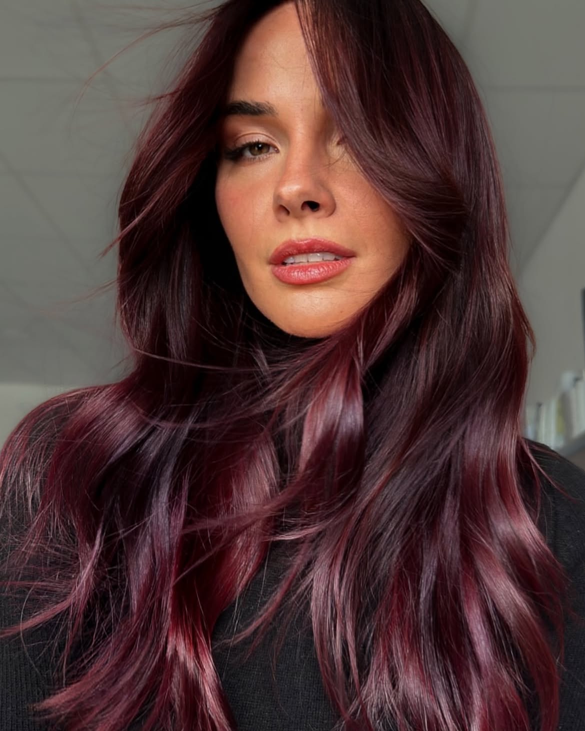 Rich Burgundy Layers With Sweeping Curtain Bangs