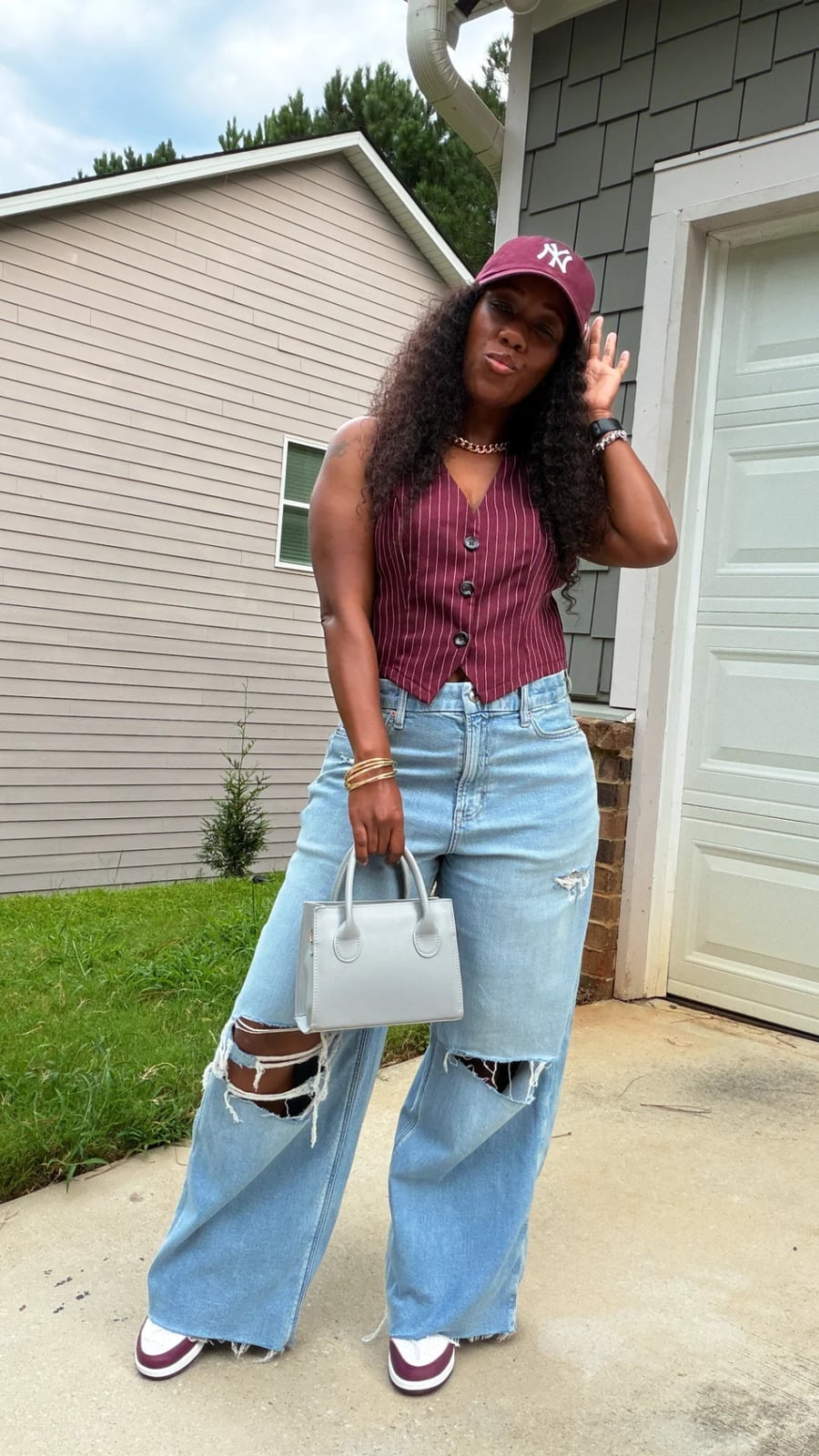 Extremely distressed baggy light blue jeans with pinstripe vest Extremely distressed baggy light blue jeans with pinstripe vest — Ripped Jeans Outfits