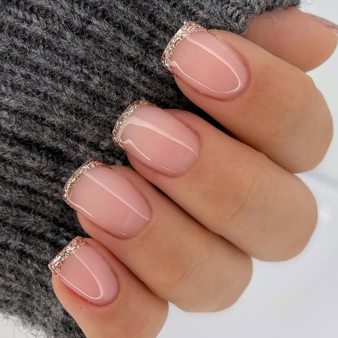 Rose Gold Glitter French Tip Almond Nails