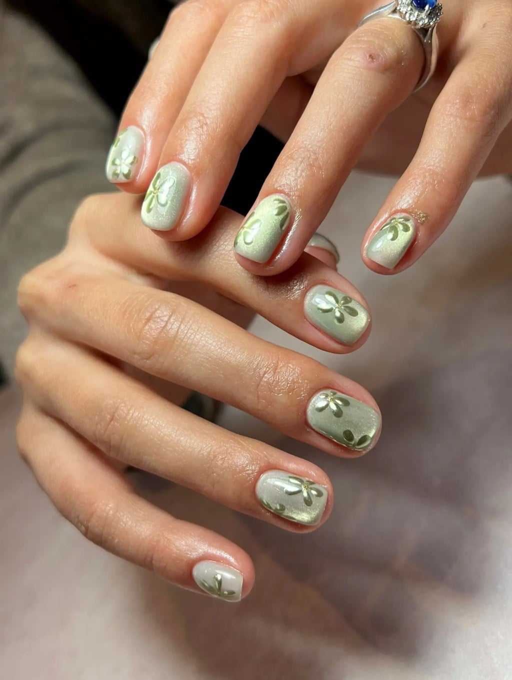 Gold Outline Floral Light Gray Satin Oval Nails Gold Outline Floral Light Gray Satin Oval Nails — Sage Nails