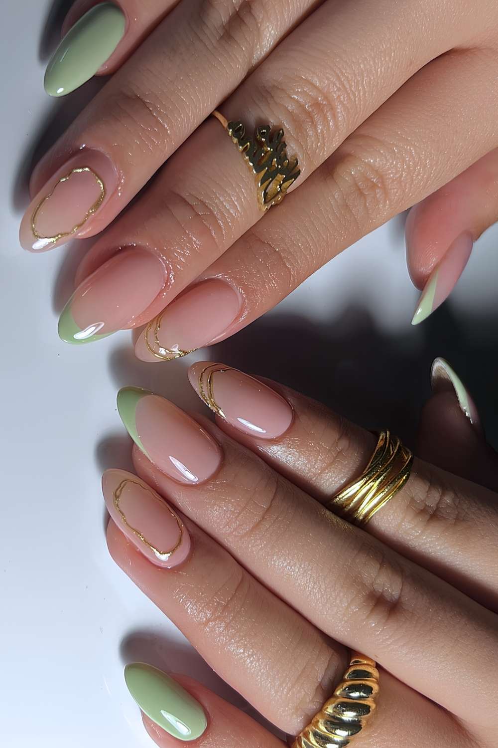 Gold Line Accent Pale Green French Medium Almond Nails, Close-Up Take Gold Line Accent Pale Green French Medium Almond Nails, Close-Up Take — Sage Nails