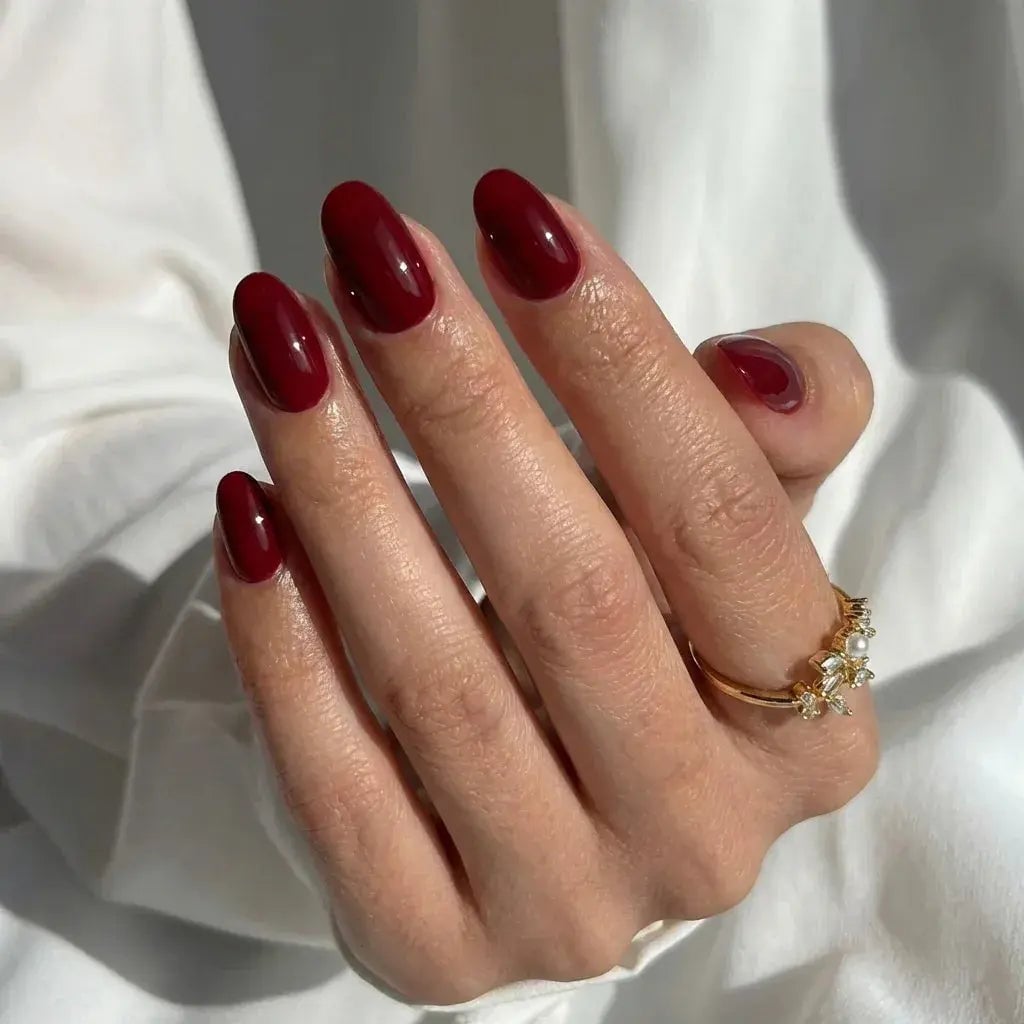 Deep Grape Red Glossy Nails, Close-Up Take Deep Grape Red Glossy Nails, Close-Up Take — Short Oval Nails