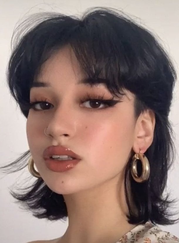 Collarbone Black Wolf Cut With Wispy Curtain Bangs Collarbone Black Wolf Cut With Wispy Curtain Bangs — Short Wolf Cut