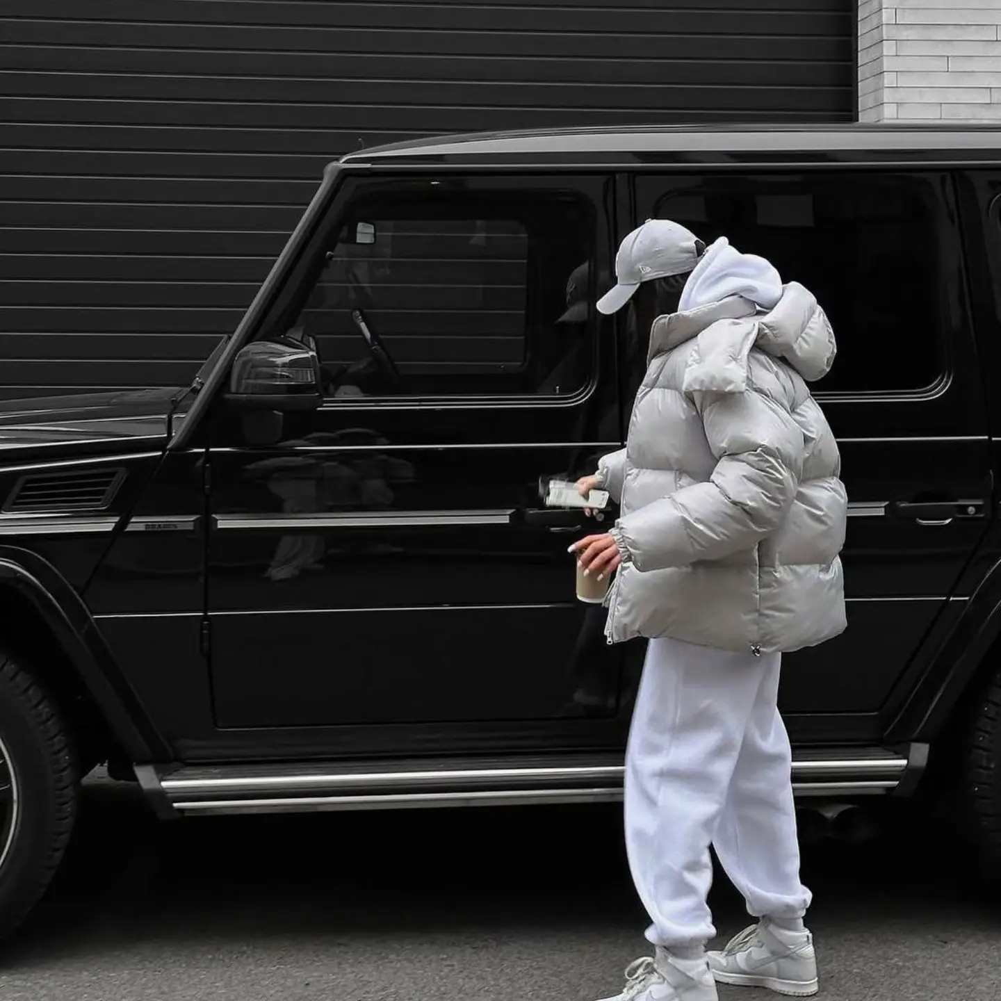 Silver Puffer Jacket And White Sweatpants Casual Look