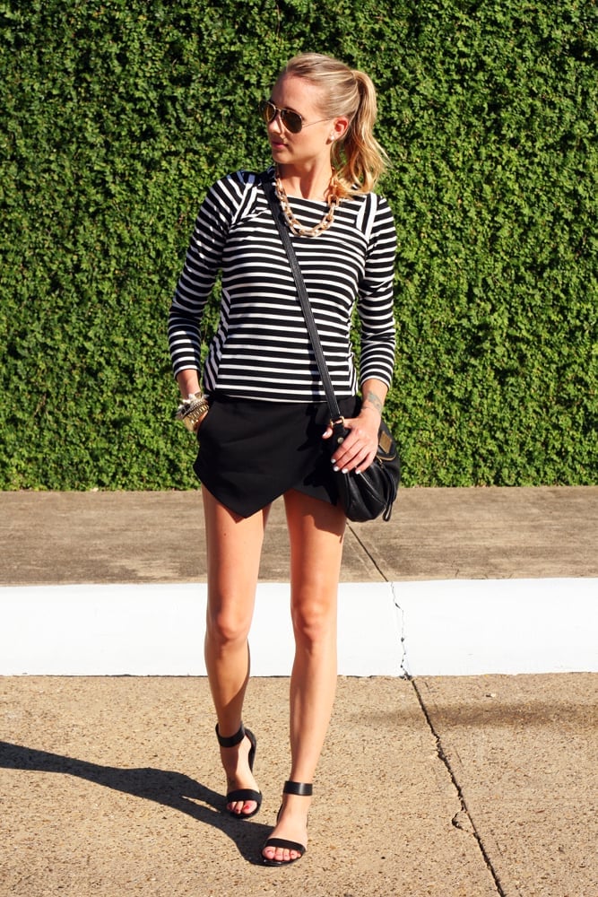 Black Tulip Skort With Striped Top and Gold Jewelry, Close-Up Take Black Tulip Skort With Striped Top and Gold Jewelry, Close-Up Take — Skort Outfits