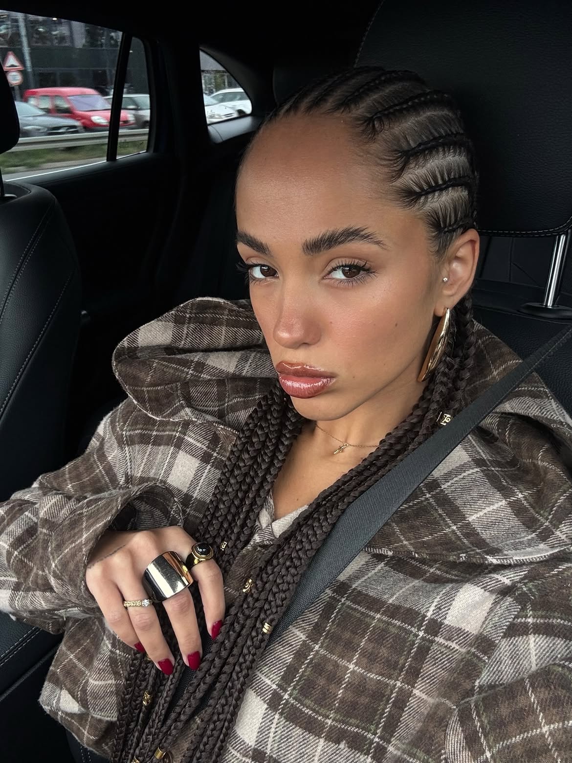 Sleek Cornrow Braids With Golden Cuffs