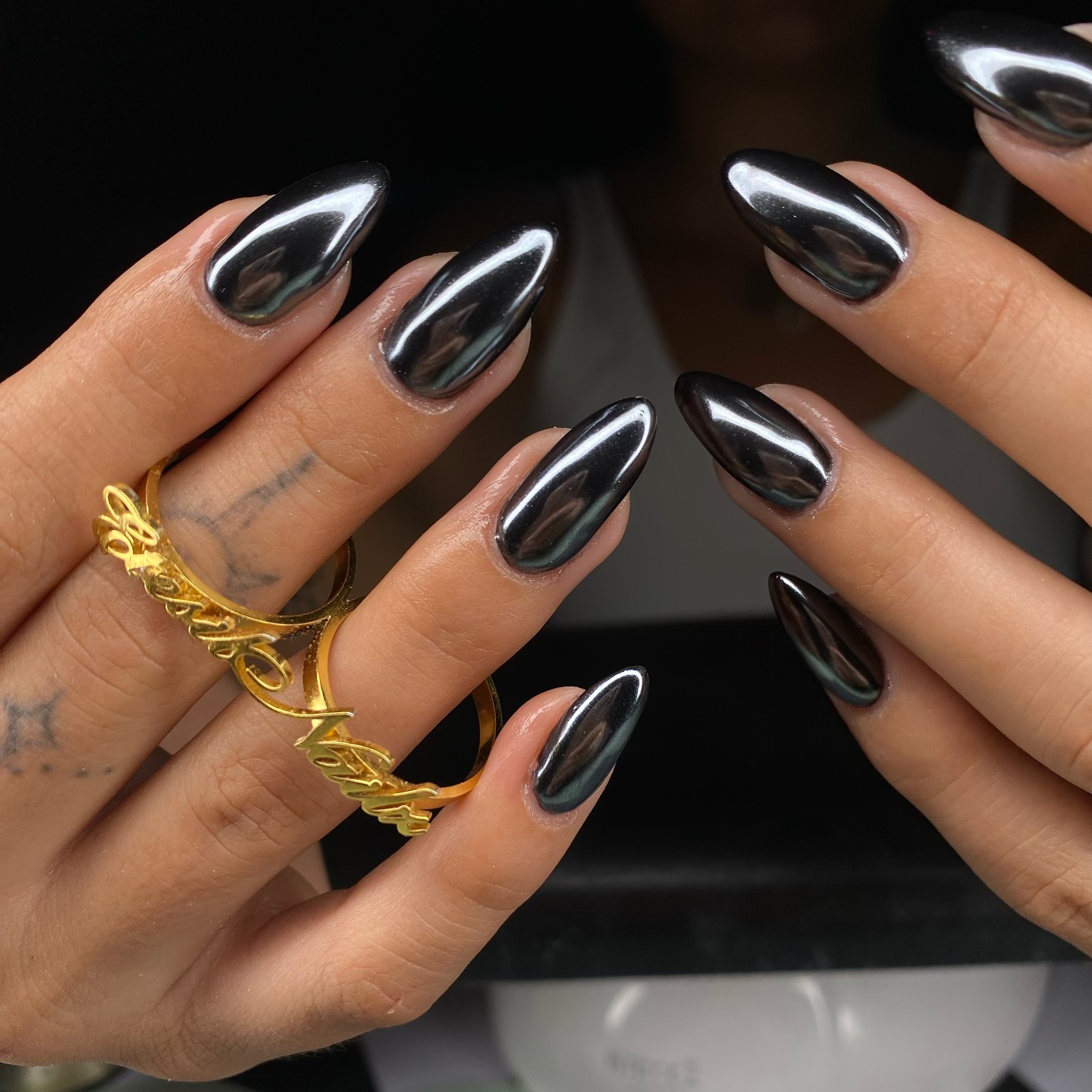 Sleek Gunmetal Chrome Almond Nails