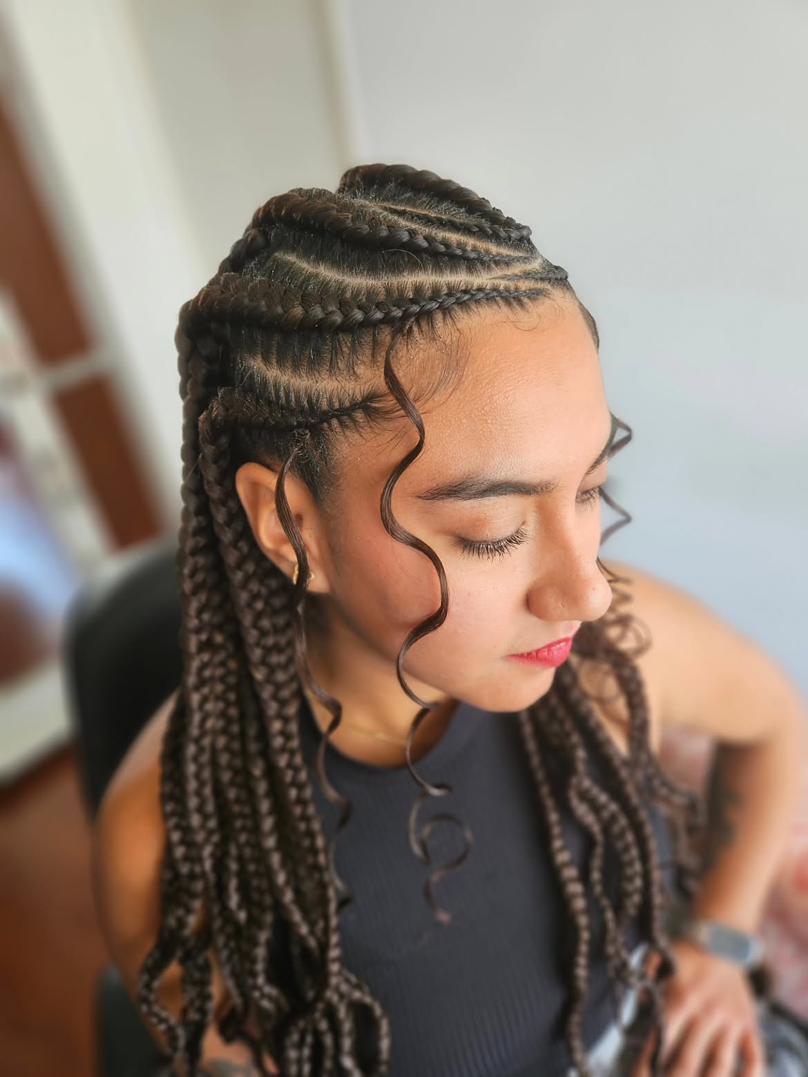 Sleek Stitch Braids With Curly Face Framing Pieces