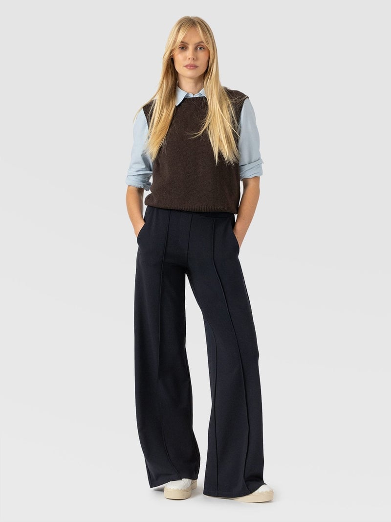 Light blue shirt with brown sweater vest and navy trousers Light blue shirt with brown sweater vest and navy trousers — Smart Casual Outfits