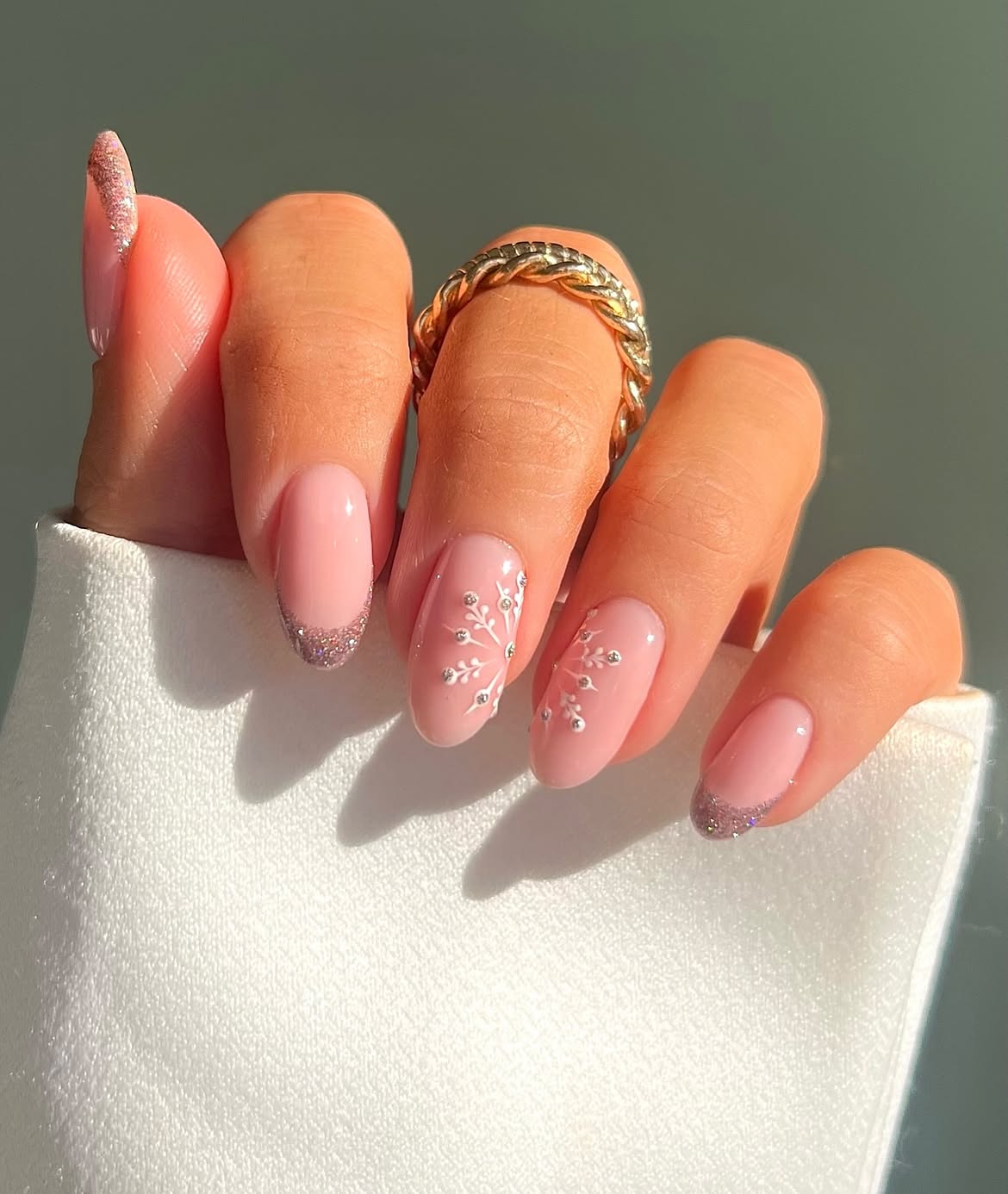 Soft Pink Glitter French Tips with Delicate Snowflakes