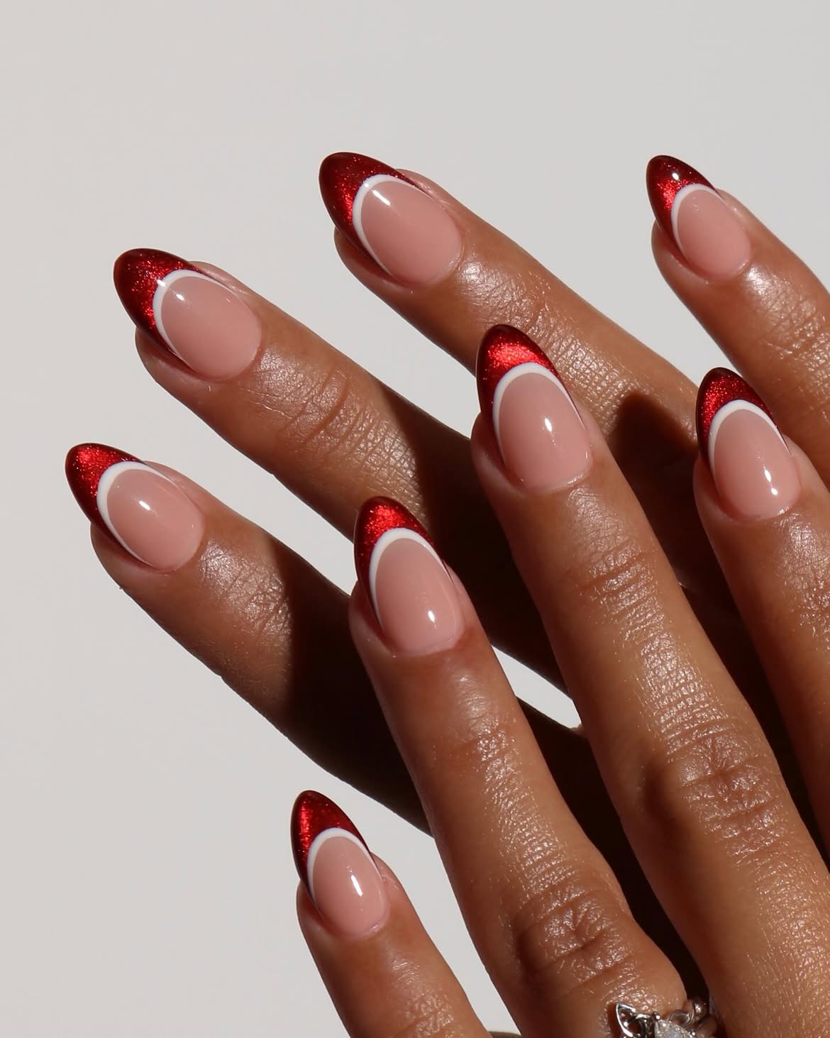 Sparkling Red & White French Tip Almond Nails