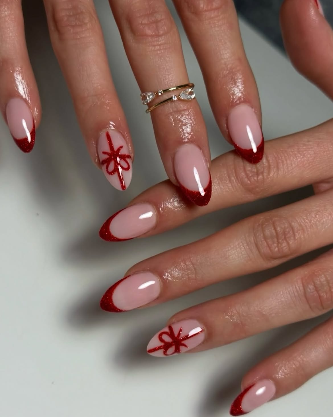 Sparkly Red French Tip Almond Nails