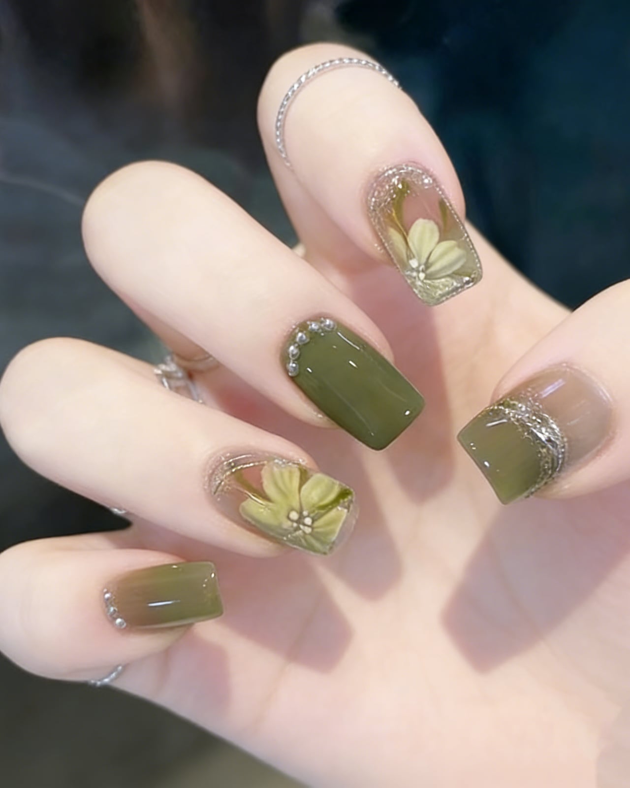 Olive Green Square Nails With 3D Floral Appliqués Olive Green Square Nails With 3D Floral Appliqués