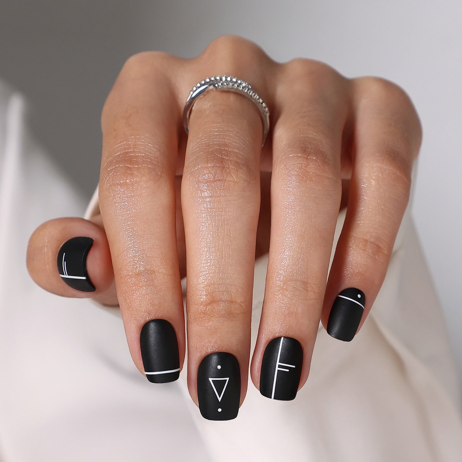 Matte Black Square Nails With White Geometric Art Matte Black Square Nails With White Geometric Art