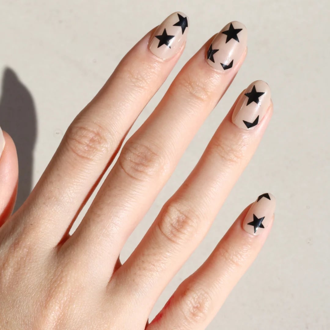 Medium Oval Beige with Black Star Decals Medium Oval Beige with Black Star Decals — Star Nails