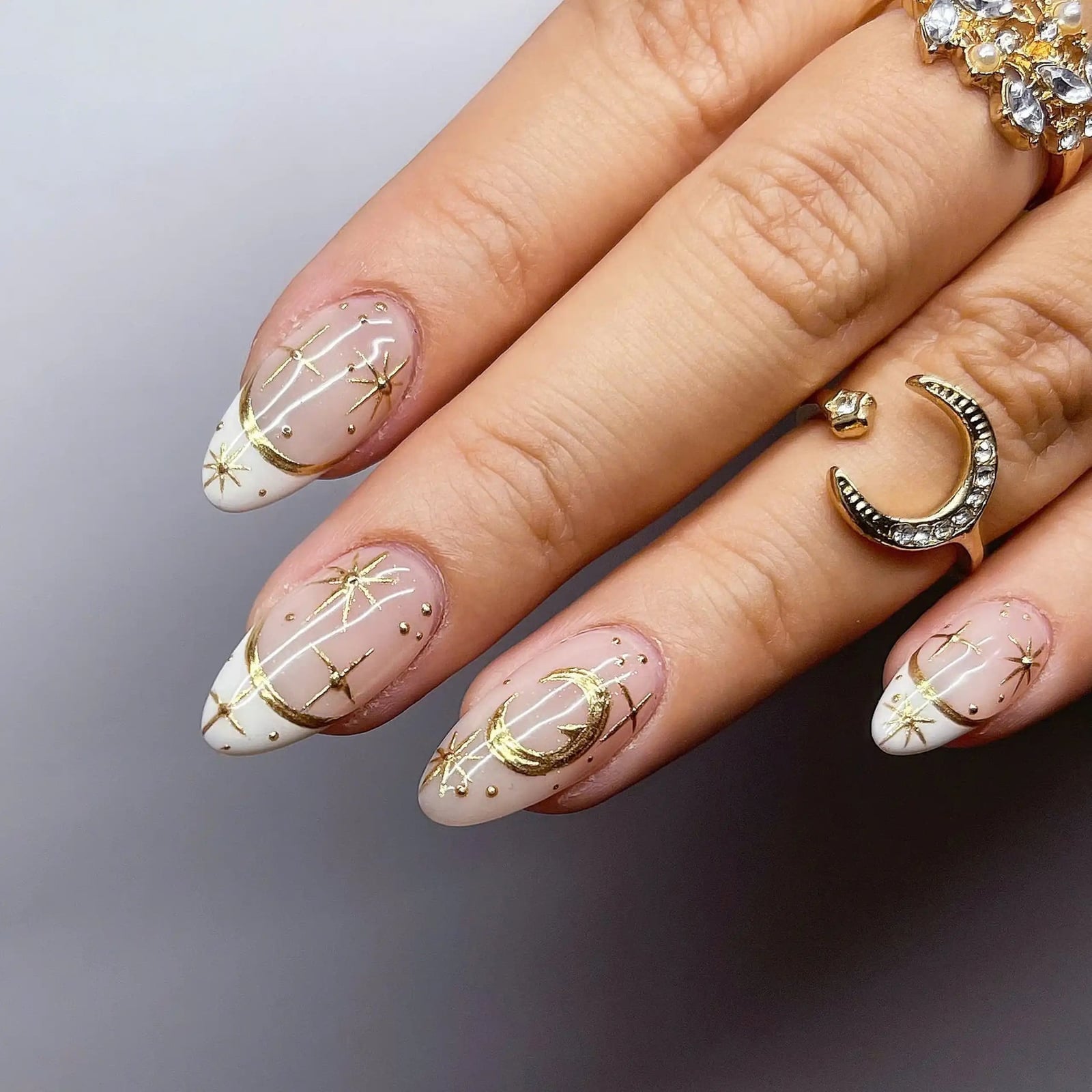 Medium Almond Nude French with Gold Celestial Decals Medium Almond Nude French with Gold Celestial Decals — Star Nails