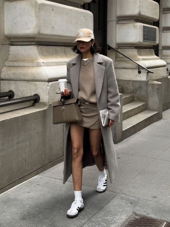 Gray wool coat over knit sweater and mini skirt Gray wool coat over knit sweater and mini skirt — Street Style Outfits