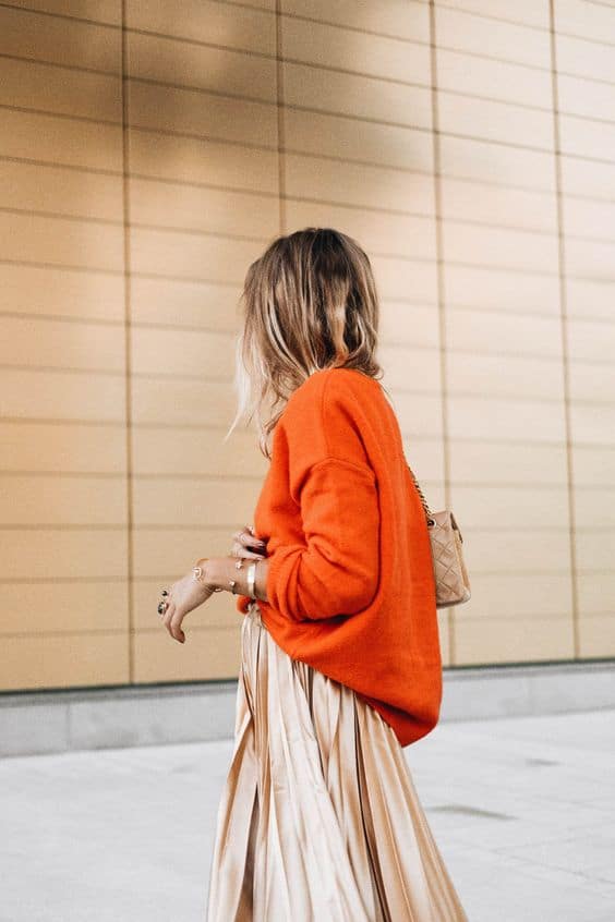 Bright orange crewneck sweater with champagne satin skirt Bright orange crewneck sweater with champagne satin skirt — Sweater Outfits for Women