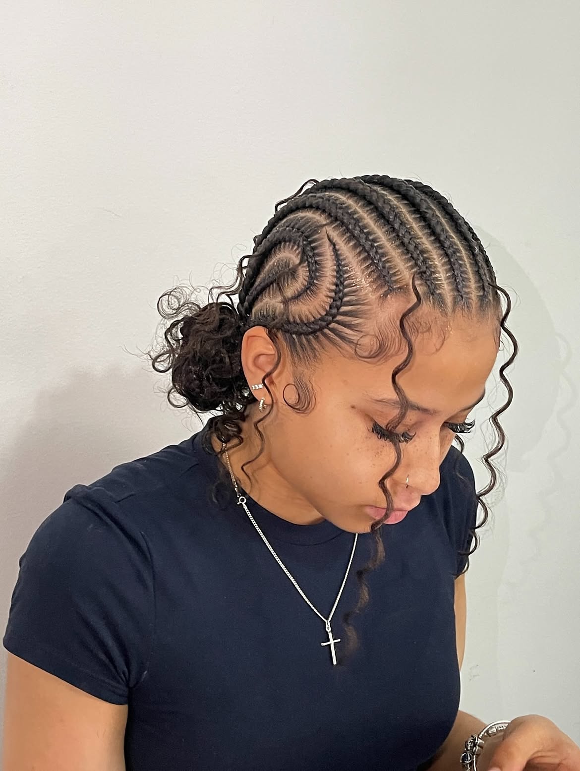 Swirled Cornrows Into Curly Low Bun