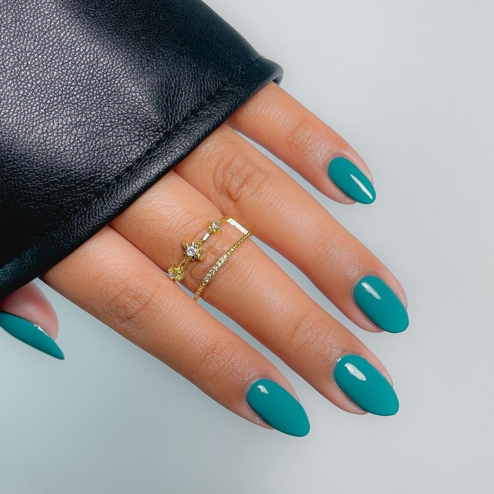 Rich Glossy Medium Oval Teal Nails, Close-Up Take Rich Glossy Medium Oval Teal Nails, Close-Up Take