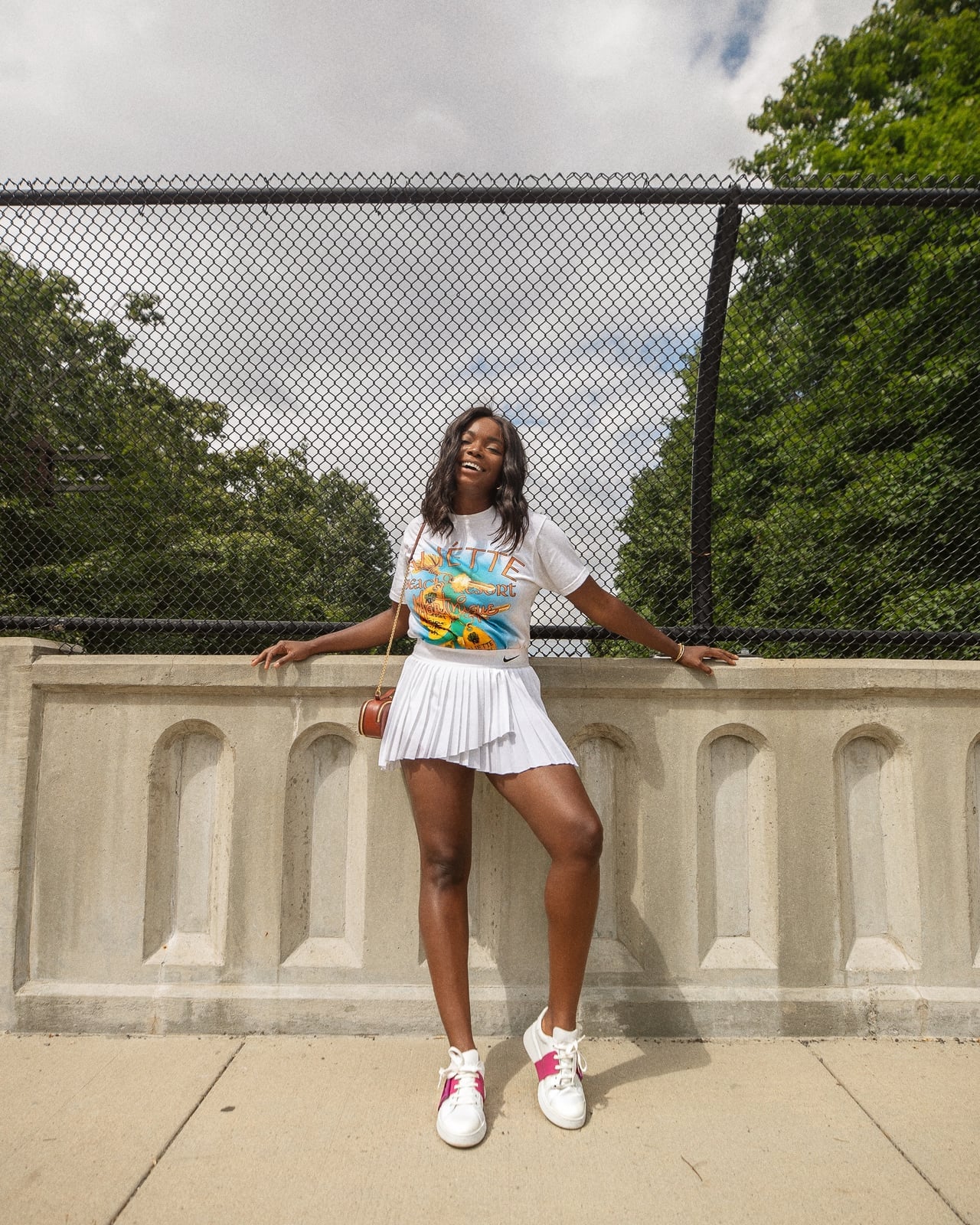 Graphic T-shirt With White Pleated Tennis Skirt Graphic T-shirt With White Pleated Tennis Skirt — Tennis Skirt Outfits