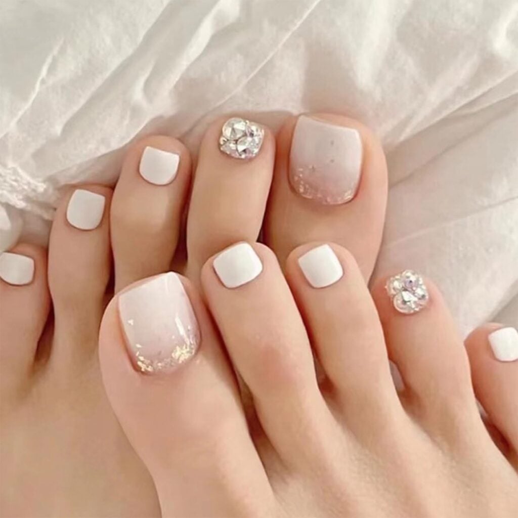Milky White and Nude Toenails with Gold Glitter and Rhinestones Milky White and Nude Toenails with Gold Glitter and Rhinestones — Toenail Colors