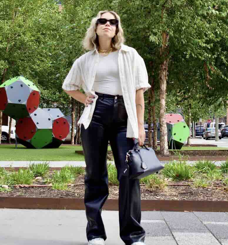 Leather trousers add texture to a casual white and black outfit Leather trousers add texture to a casual white and black outfit — Trouser Outfits