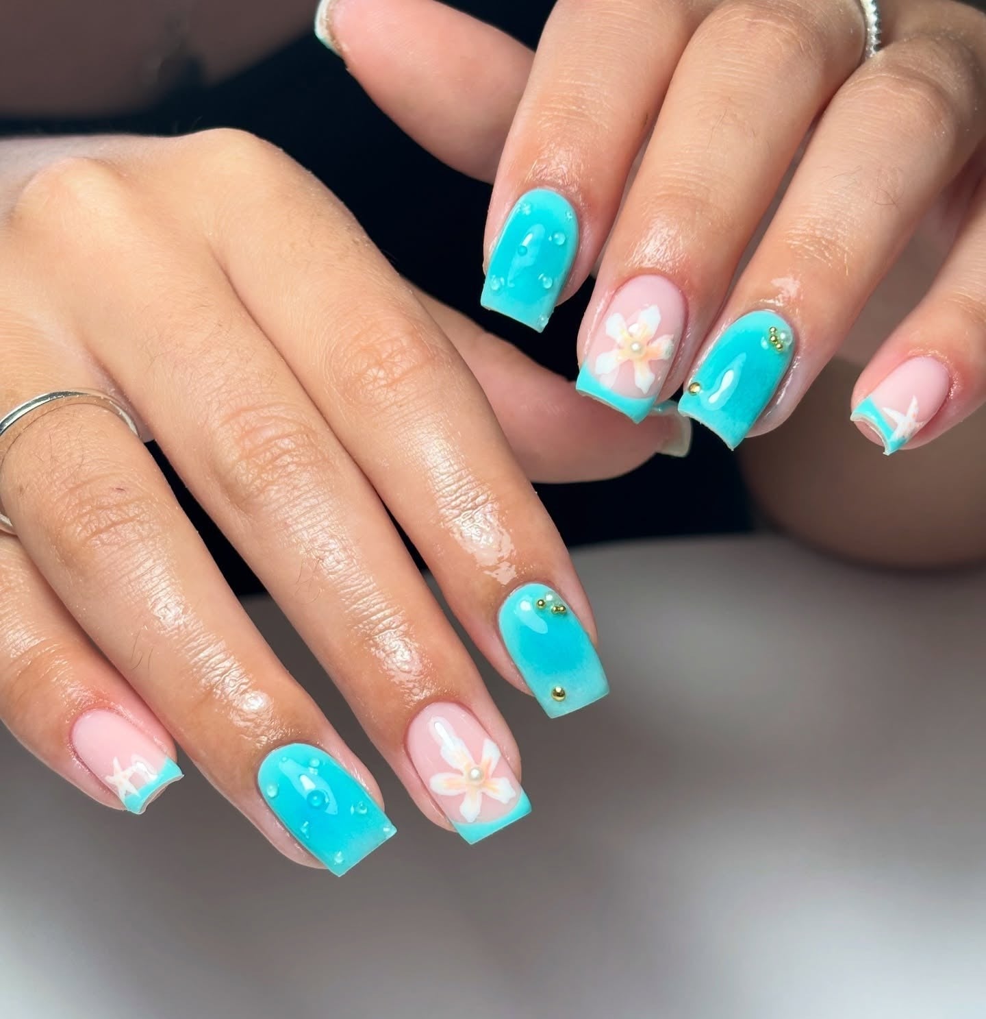 Turquoise French Tips with Flower and Beads Turquoise French Tips with Flower and Beads — Turquoise Nails