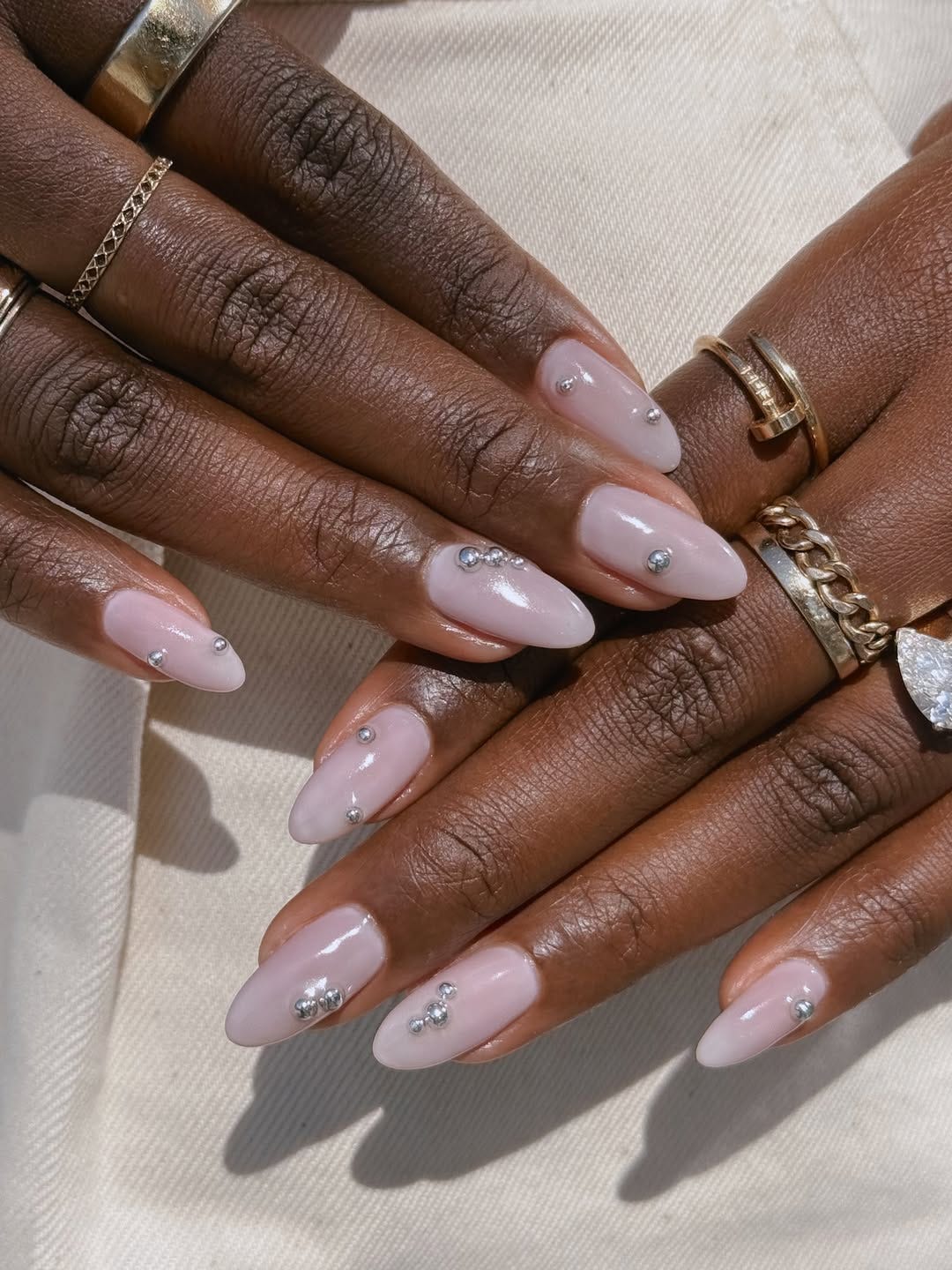 Silver Studs Sheer Milky Pink Medium Almond Nails Silver Studs Sheer Milky Pink Medium Almond Nails — Unique Nails