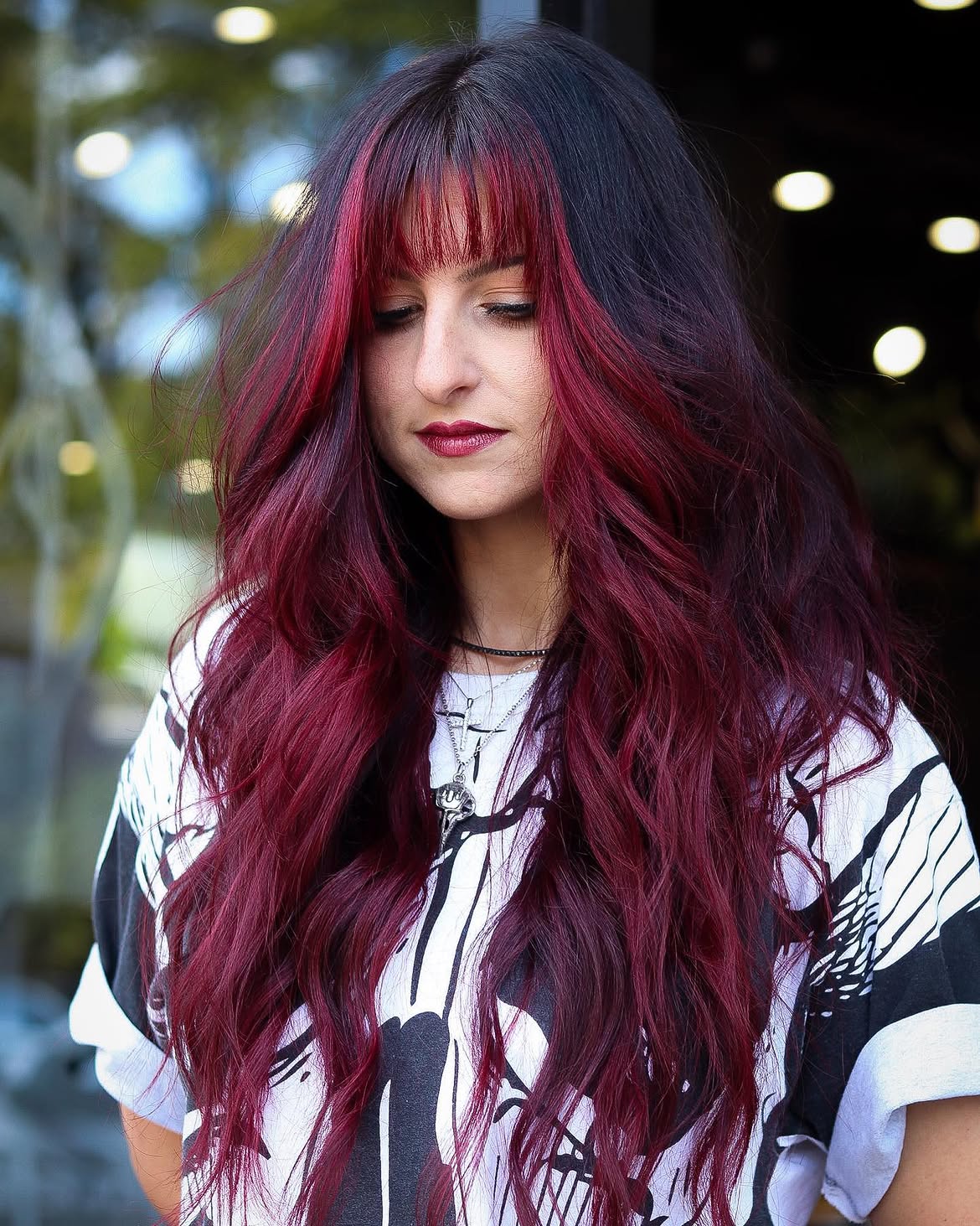 Vibrant Burgundy Face Framing Layers With Wispy Bangs