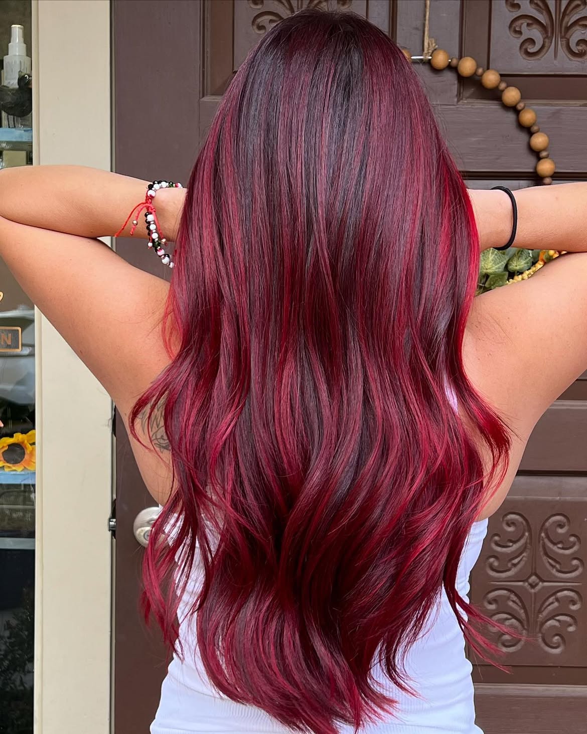 Vibrant Red Highlights On Dark Burgundy Hair