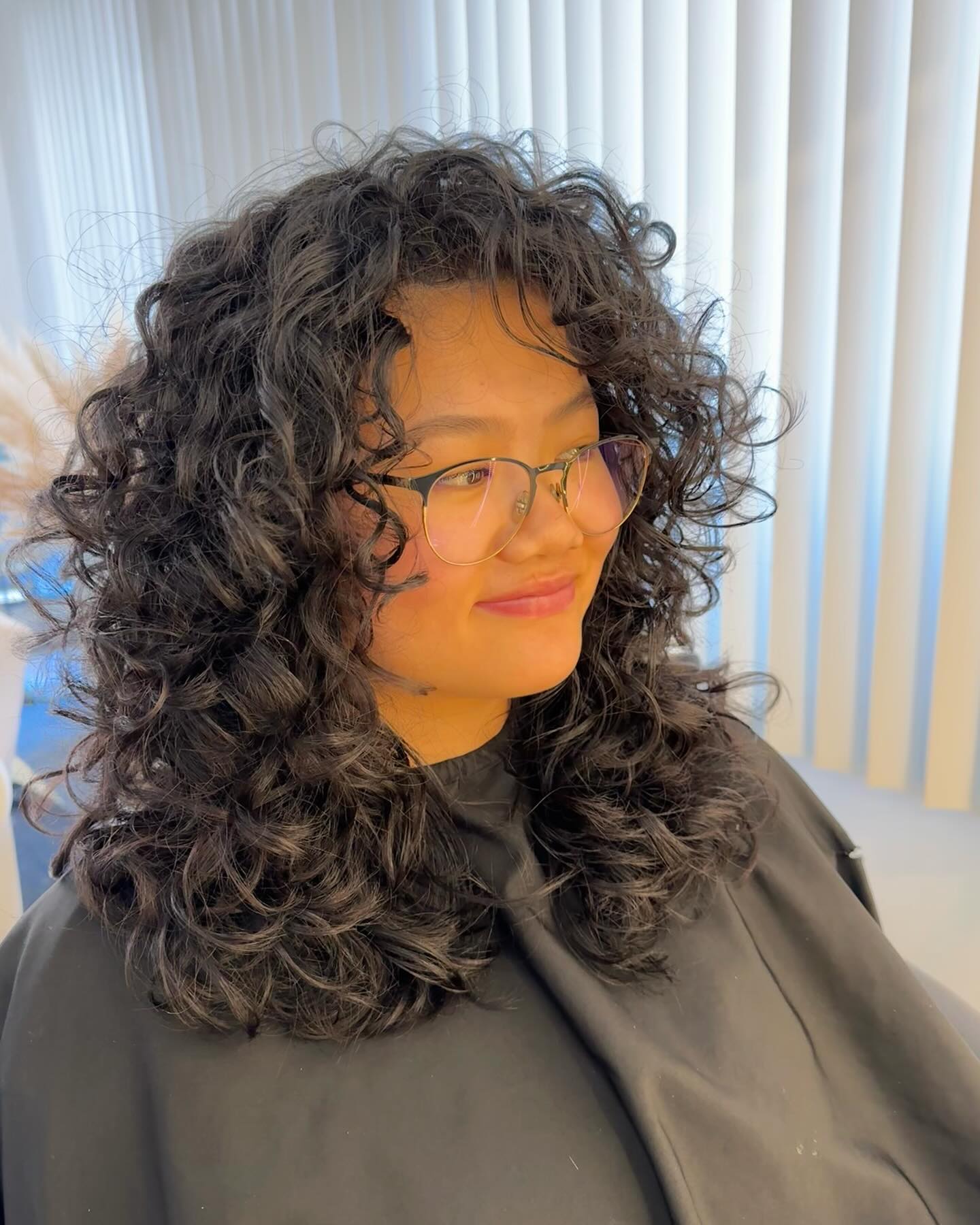Voluminous Curly Cut With Face-Framing Layers