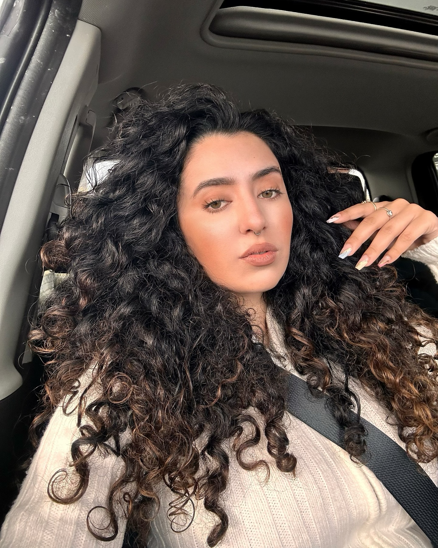 Voluminous Dark Curls With Warm Brown Highlights