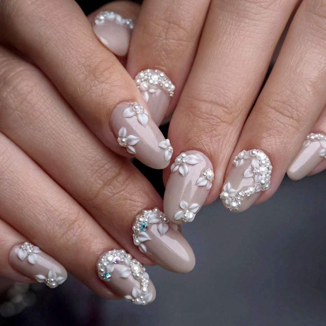 Neutral Beige Oval Nails with 3D Floral Embellishments Neutral Beige Oval Nails with 3D Floral Embellishments — Wedding Nails for Bride