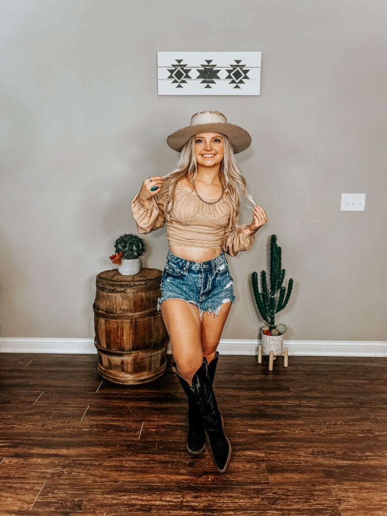Tan long-sleeve crop top with denim shorts and wide-brimmed hat Tan long-sleeve crop top with denim shorts and wide-brimmed hat — Western Style