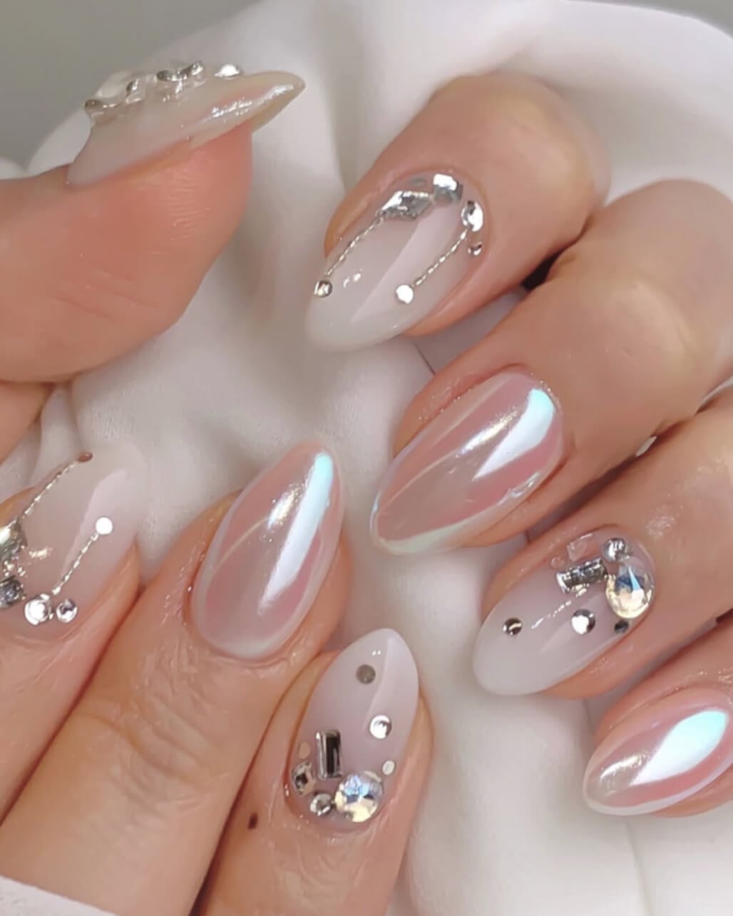 Milky Pearl Shimmer Almond Nails with Charms Milky Pearl Shimmer Almond Nails with Charms — White Acrylic Nails