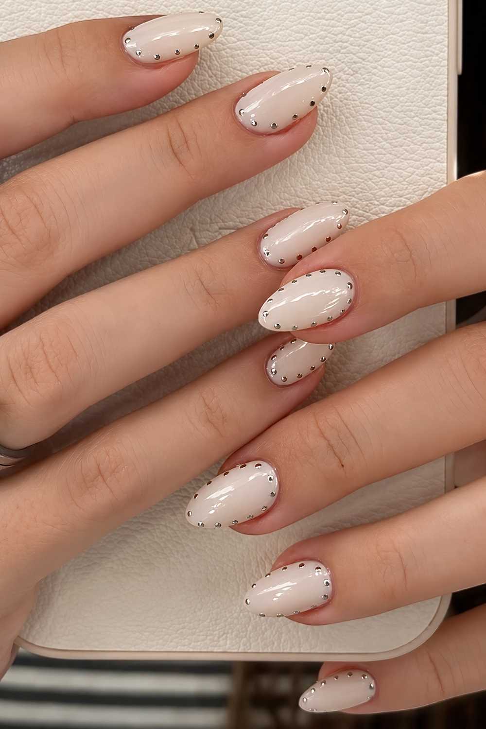 Short Almond Pale Nude Silver Stud Nails Short Almond Pale Nude Silver Stud Nails — White Nails