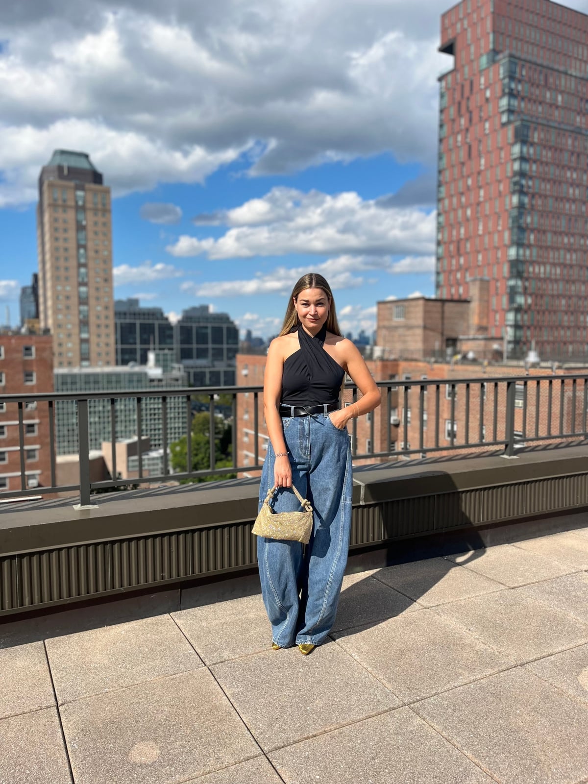 Wide Leg Jeans With Black Halter Top And Gold Handbag Wide Leg Jeans With Black Halter Top And Gold Handbag — Wide Leg Jeans Outfits