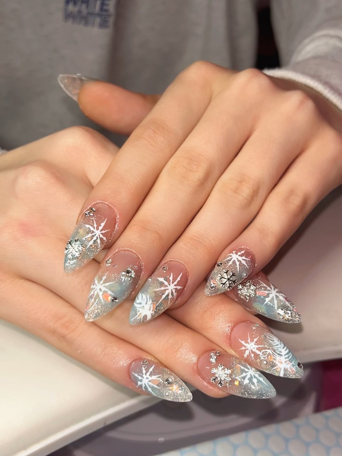 Winter Snowflake Stiletto Nails with Glitter Accents