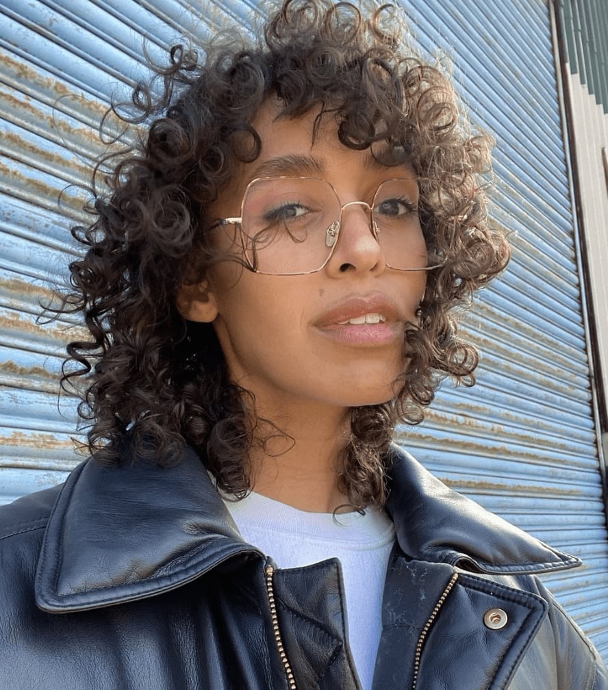 Shoulder Length Curly Wolf Cut With Short Bangs Shoulder Length Curly Wolf Cut With Short Bangs — Wolf Cut Hair